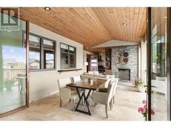 454 Sq Ft. Overlooks Pool Deck, Gas Outdoor Fireplace, Pass Through From Kitchen, Feature Ceiling, Automatic Screens to Exterior. -