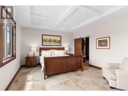 Primary bedroom with large windows, great views, coffered ceiling -