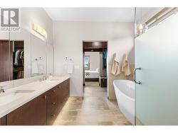 Dual sinks, soaker tub and large walk in tiled shower -