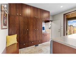 Friends and family entrance from side of home with custom cabinetry and laundry. -