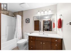 Lower level bathroom with built in linen closet. -