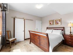 Lower level bedroom 2 with access door to suite for versatile options for family and guests. -