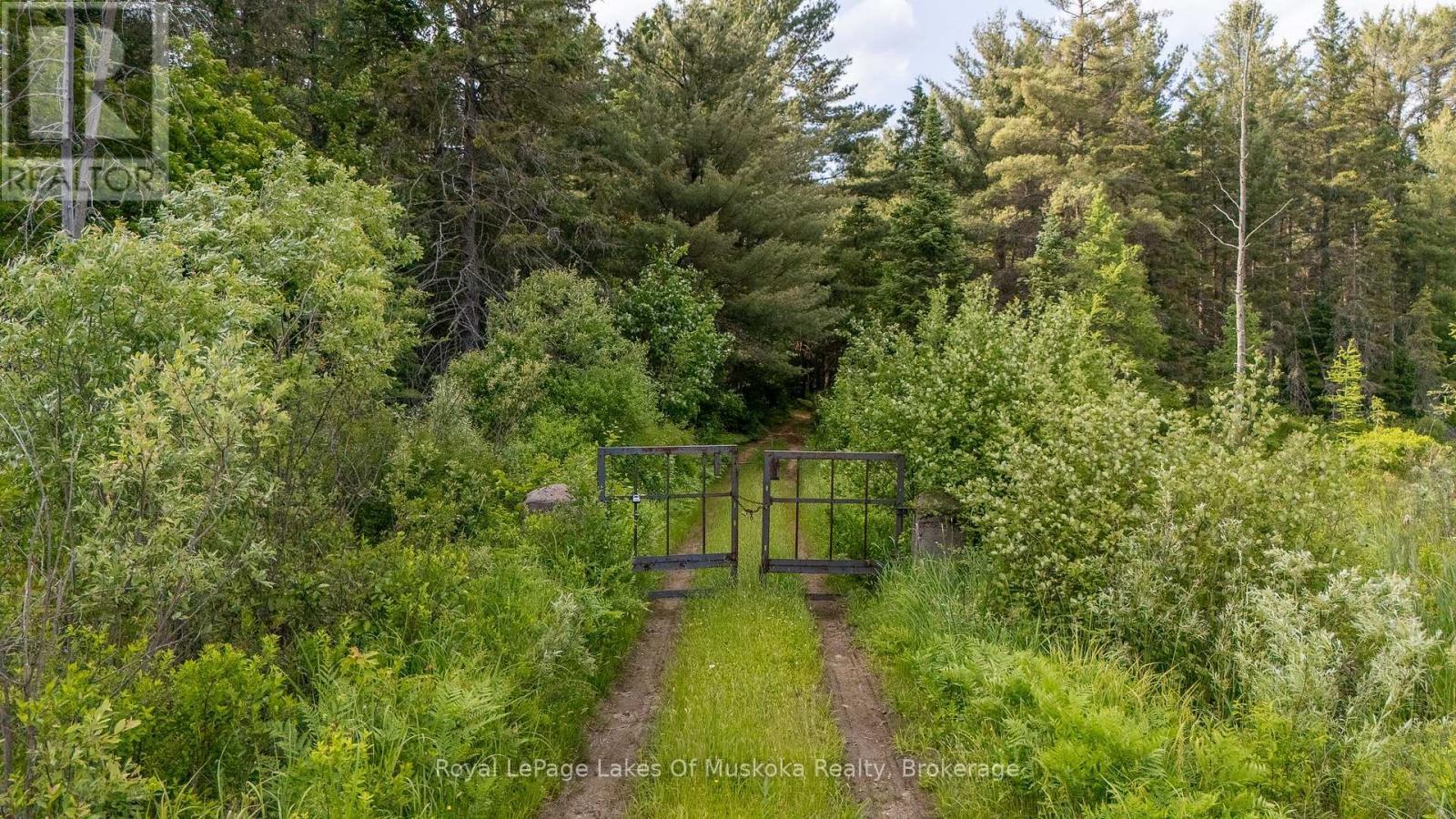 Gated Entrance to the Property off Paved Road - 1958 518 Highway, Mcmurrich/Monteith (Sprucedale), ON - Outdoor With View