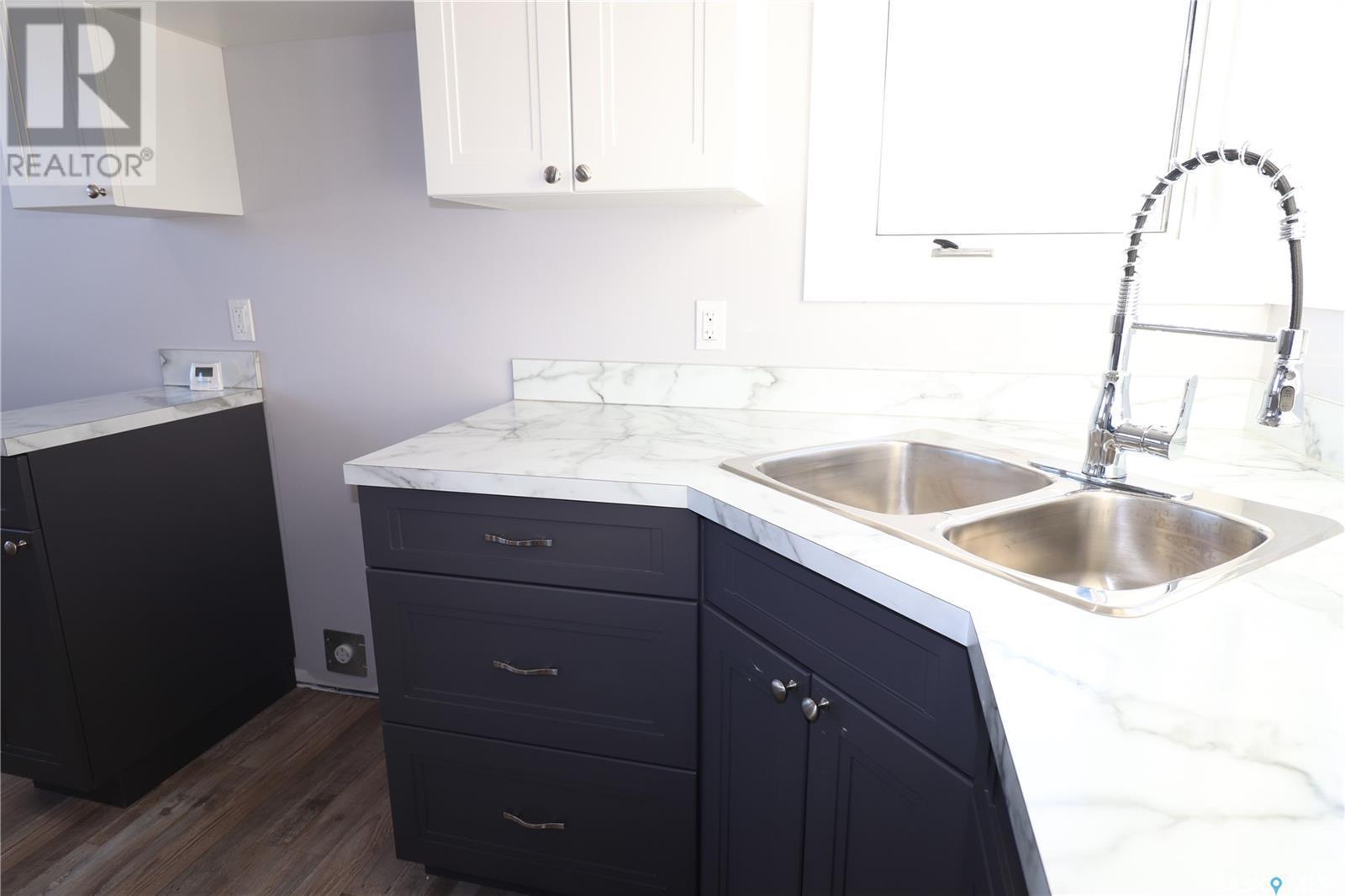 110 Wally Hunt Drive, La Ronge, SK - Indoor Photo Showing Kitchen With Double Sink
