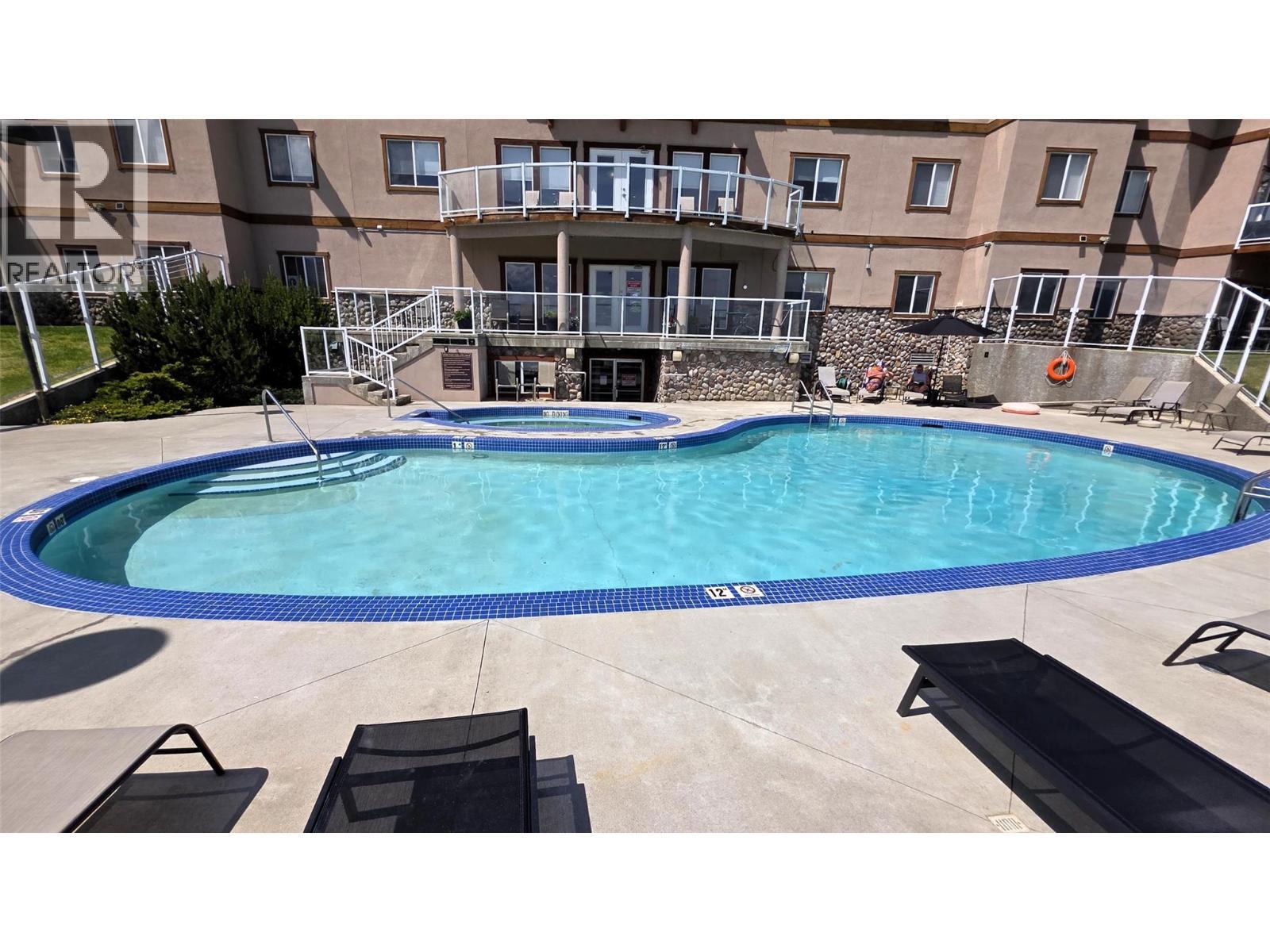701 14A Crescent Unit# 213 I, Invermere, BC - Outdoor With In Ground Pool With Backyard