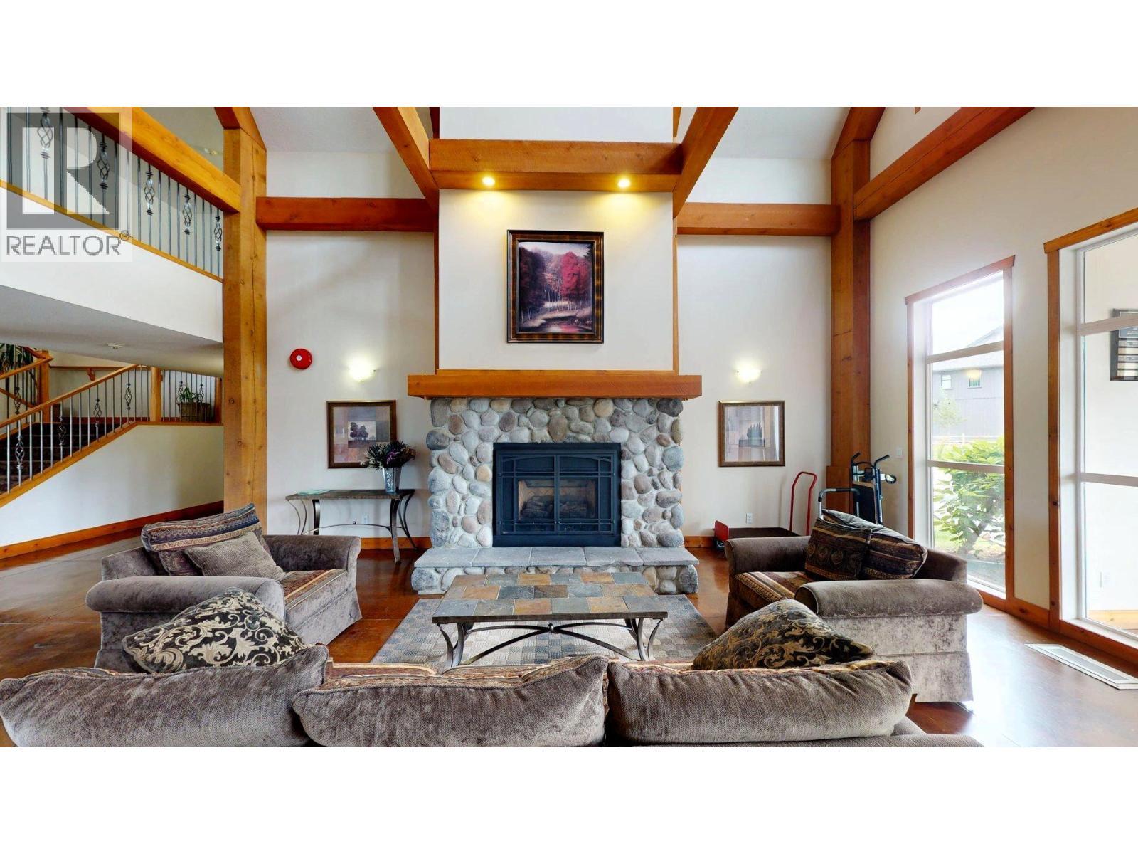 701 14A Crescent Unit# 213 I, Invermere, BC - Indoor Photo Showing Living Room With Fireplace