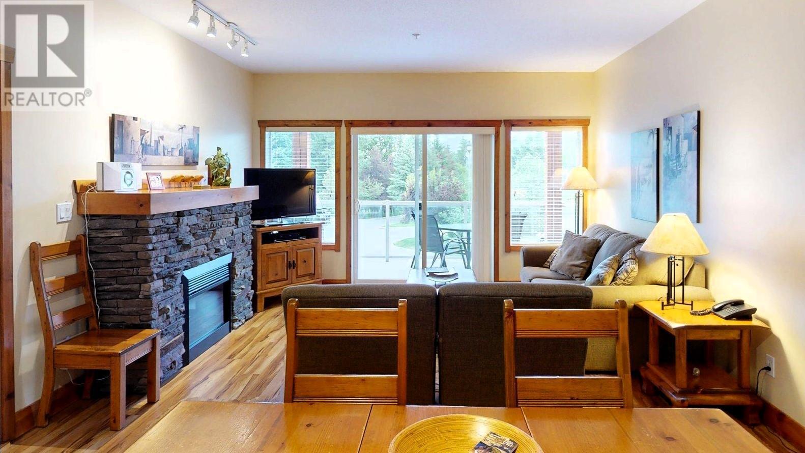 701 14A Crescent Unit# 213 I, Invermere, BC - Indoor Photo Showing Living Room With Fireplace