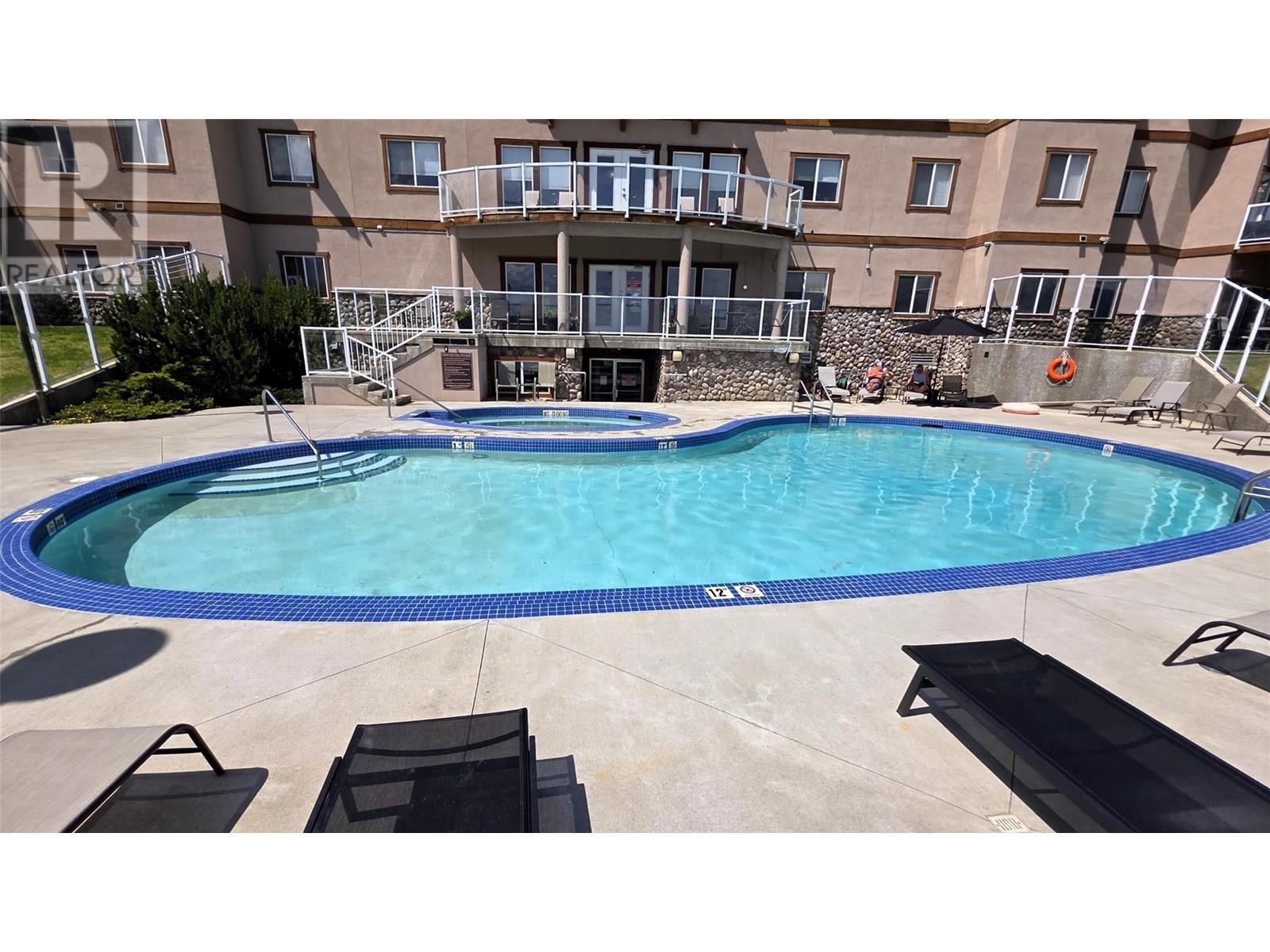 701 14A Crescent Unit# 213 I, Invermere, BC - Outdoor With In Ground Pool With Backyard