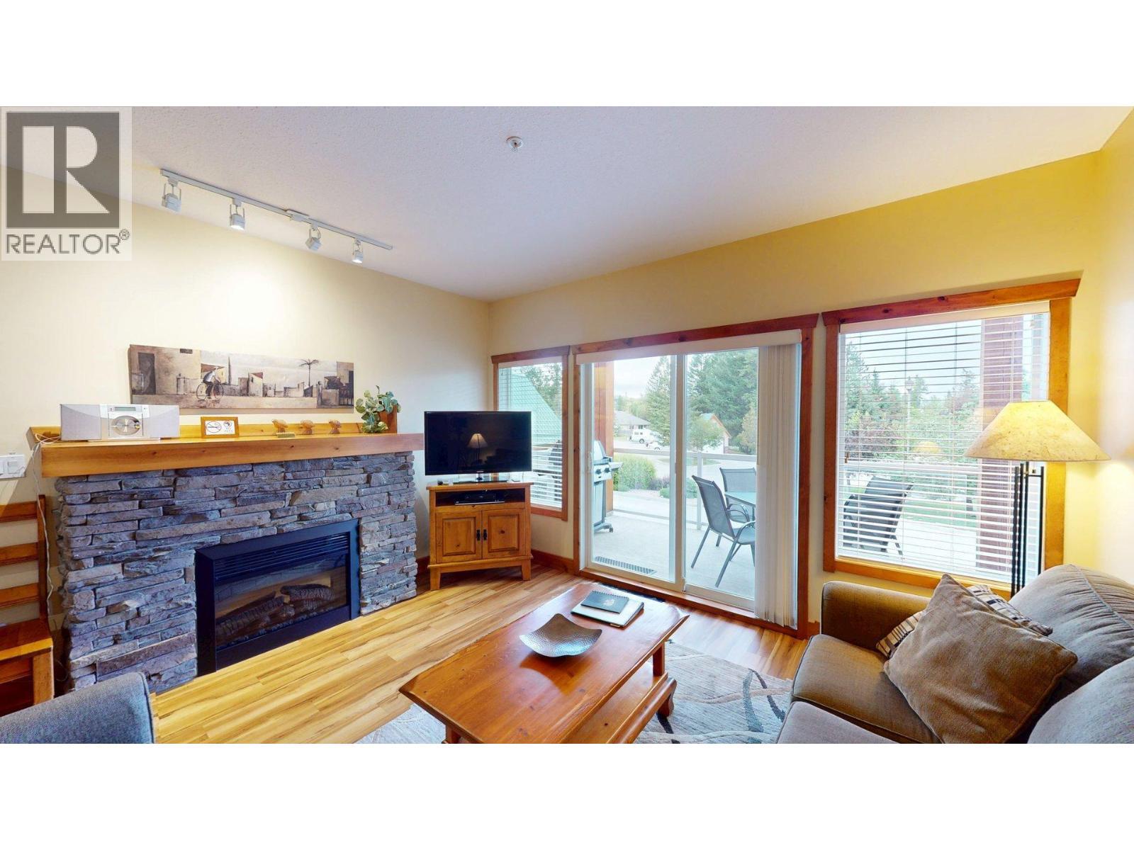 701 14A Crescent Unit# 213 I, Invermere, BC - Indoor Photo Showing Living Room With Fireplace