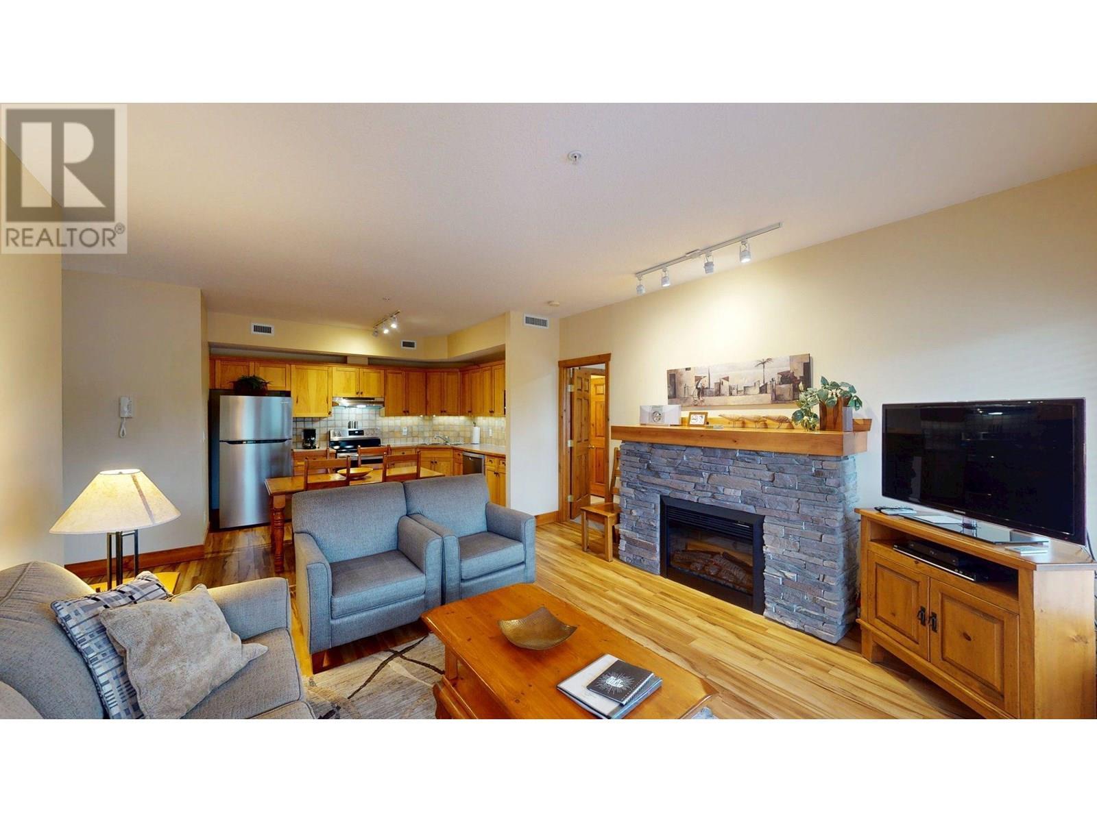 701 14A Crescent Unit# 213 I, Invermere, BC - Indoor Photo Showing Living Room With Fireplace