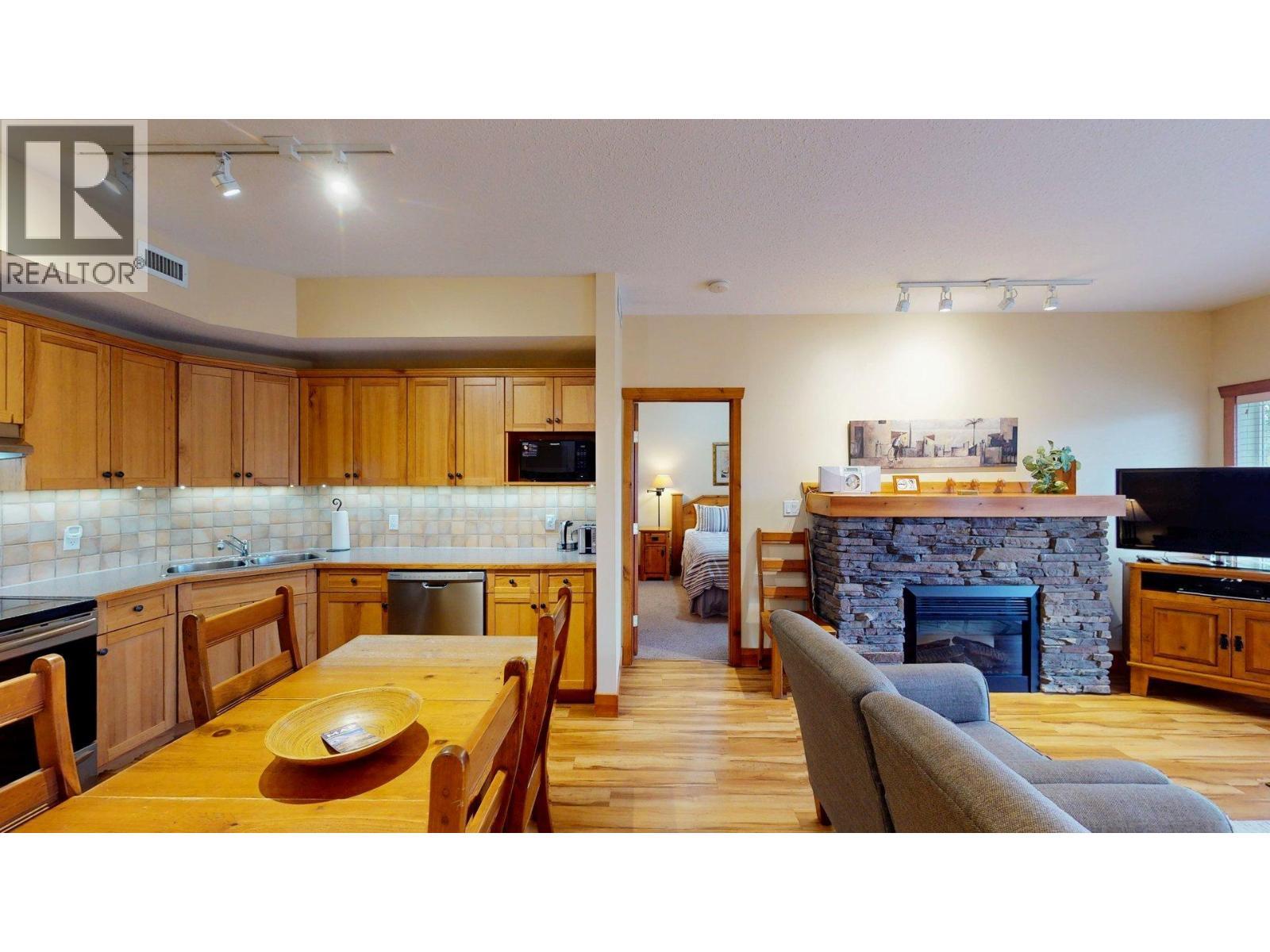 701 14A Crescent Unit# 213 I, Invermere, BC - Indoor With Fireplace