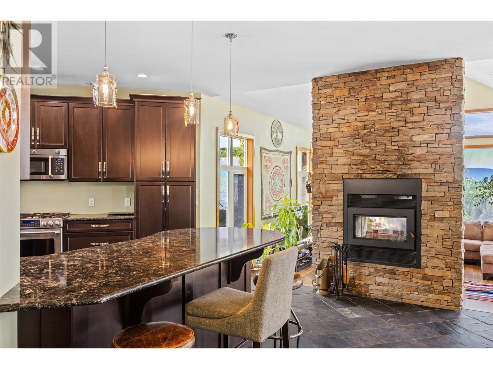 Kitchen - 365 Riverwind Drive, Chase, BC - Indoor With Fireplace