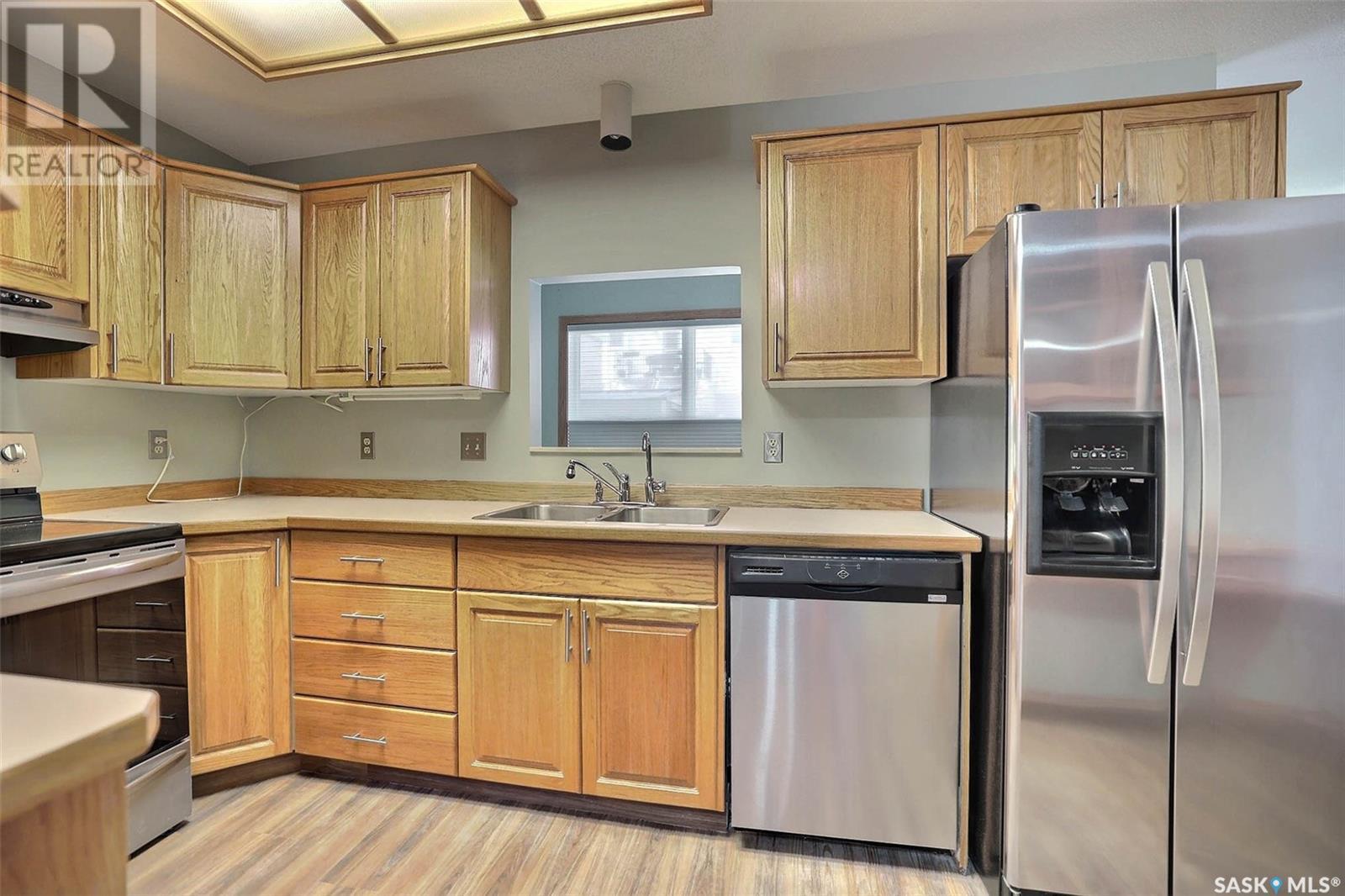 25 2338 Assiniboine Avenue E, Regina, SK - Indoor Photo Showing Kitchen With Double Sink