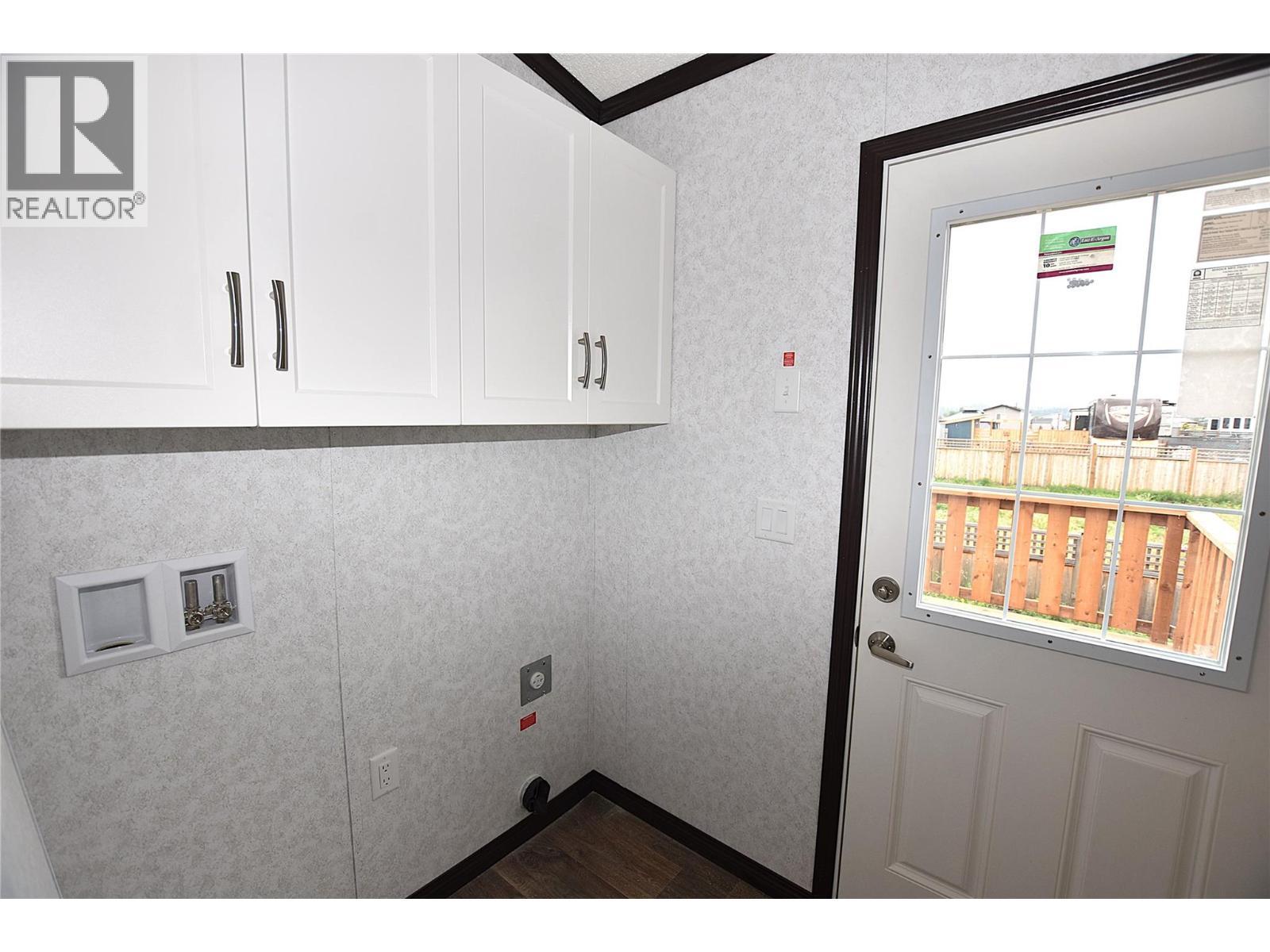 laundry area/back door - 61 Antoine Road Unit# 24, Vernon, BC