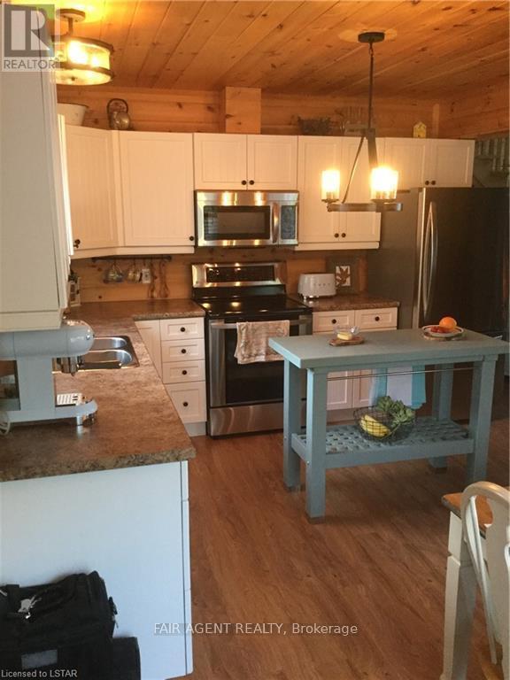 1165B Kirk Kove Road, Frontenac (Frontenac Centre), ON - Indoor Photo Showing Kitchen With Double Sink