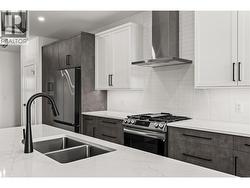 Kitchen. Photos taken from similar home in the community. -