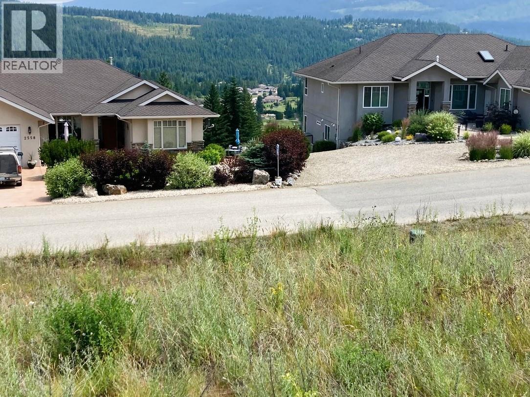 golf course can be seen between the homes across the street - 2555 Highlands Drive, Blind Bay, BC