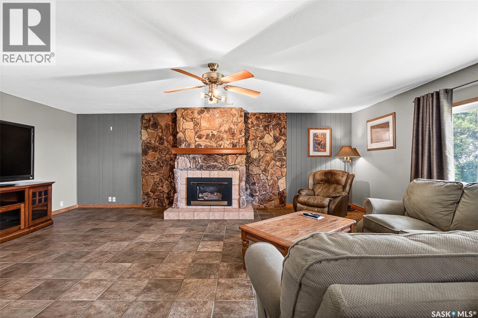 Stony Beach Acreage, Pense Rm No. 160, SK - Indoor Photo Showing Living Room With Fireplace