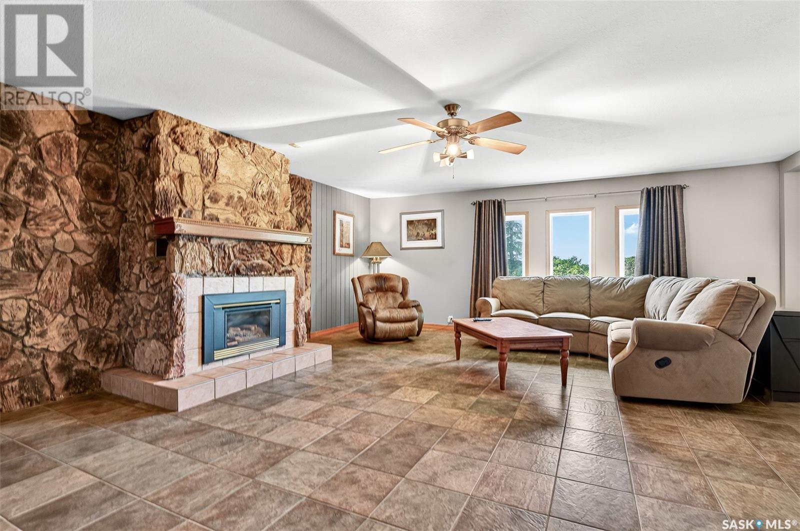 Stony Beach Acreage, Pense Rm No. 160, SK - Indoor Photo Showing Living Room With Fireplace
