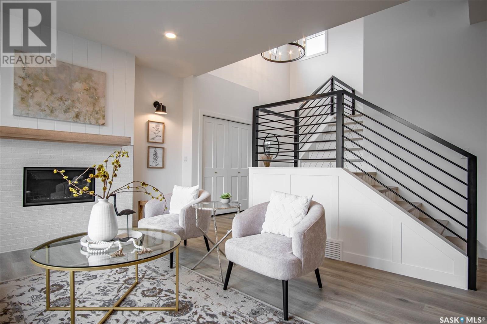 14 Sunterra Drive, Shields, SK - Indoor Photo Showing Living Room With Fireplace
