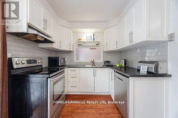 73 - 7080 Copenhagen Road, Mississauga, ON - Indoor Photo Showing Kitchen With Double Sink