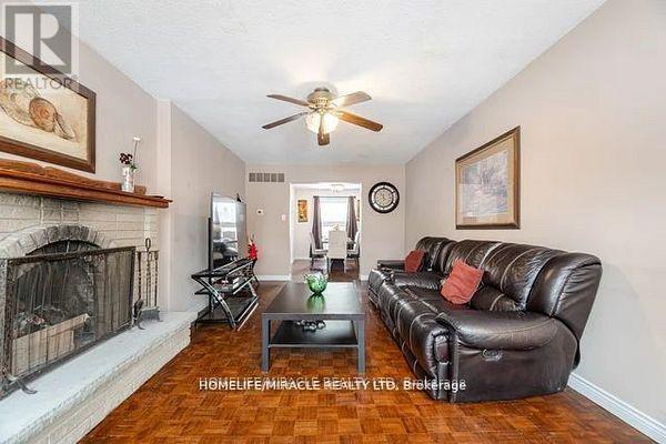 73 - 7080 Copenhagen Road, Mississauga, ON - Indoor Photo Showing Living Room With Fireplace