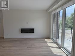 Living area with sliding doors to the 2nd patio on the mail level -