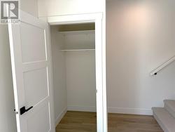 Storage closet and stairs on main level off of living area -