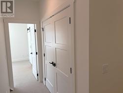 Laundry room doors and entry to primary suite -