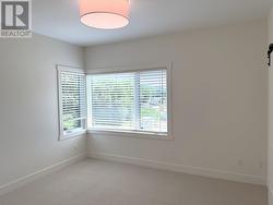 Primary bedroom with large corner windows -