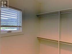 Primary bedroom, extra large walk in closet with organizers and window! -