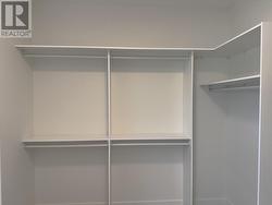 Primary bedroom, extra large walk in closet with organizers -