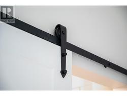 Barn door closets into primary ensuite and large walk in closet with organizers -