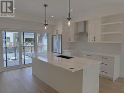 Kitchen with extra large island with seating for 4 people -