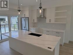 Kitchen with extra large island with seating for 4 people -