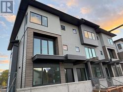Building 1 Exterior facing Woodsdale Road - Townhome 3 is second from left -