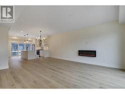 Living/dining area with 2nd patio off of living area and electric fireplace -