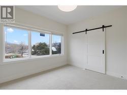 Oversized windows in primary bedroom. Blinds included throughout the home. -
