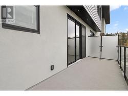 Patio with sliding doors off of the kitchen. -