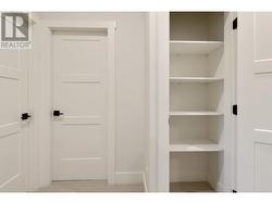 Bedroom level linen closet by laundry room -