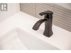 Ensuite vanity. Home features matte black pluming fixture package -