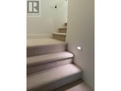 Stairwell carpeting and lighting - -