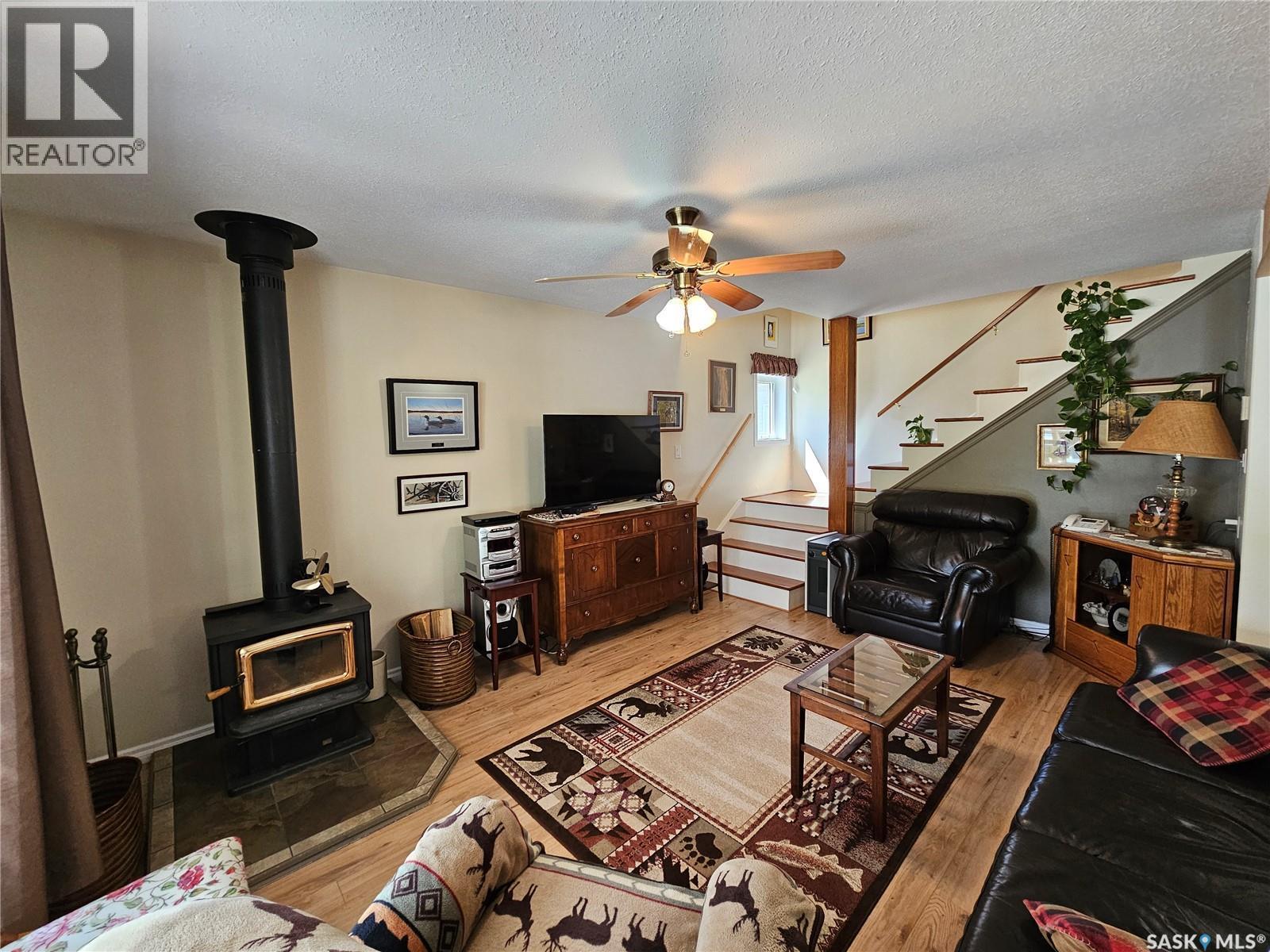 109 Aspen Drive, Meadow Lake Rm No.588, SK - Indoor Photo Showing Living Room With Fireplace