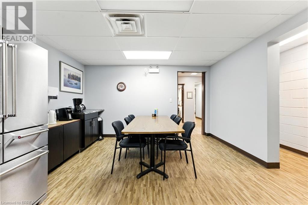 Dining area featuring a paneled ceiling and light wood-style flooring - 207 Greenwich Street, Brantford, ON