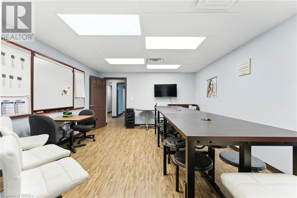 Home office with light wood-type flooring and a paneled ceiling - 207 Greenwich Street, Brantford, ON