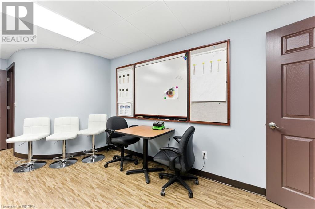 Office featuring wood finished floors and baseboards - 207 Greenwich Street, Brantford, ON