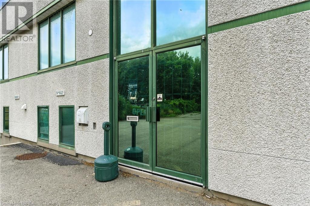 View of exterior entry featuring stucco siding - 207 Greenwich Street, Brantford, ON