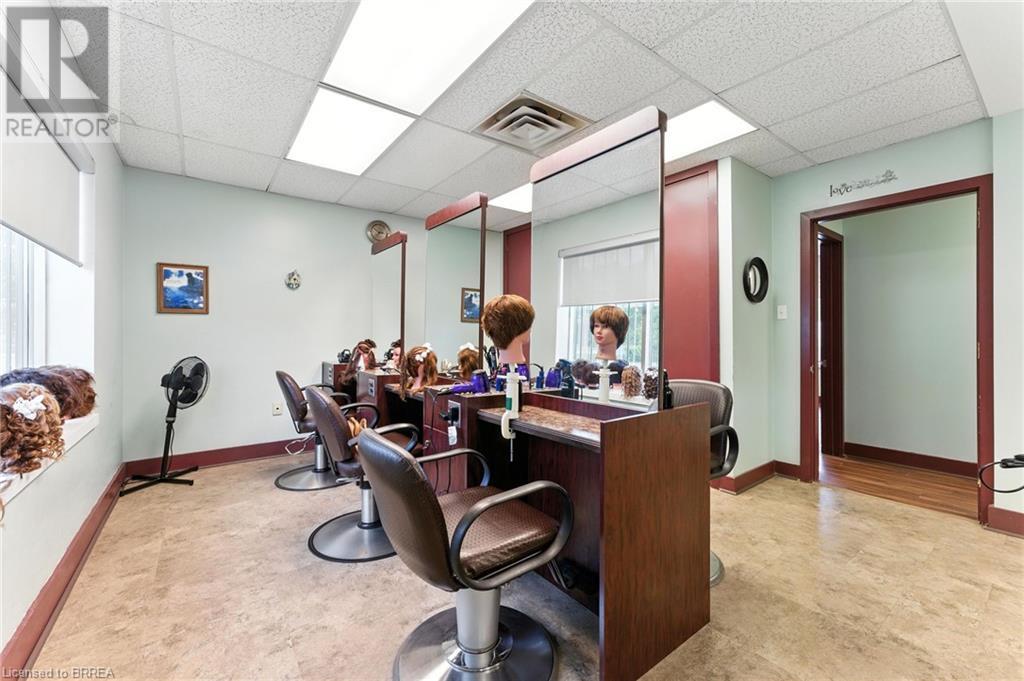 Office space featuring a drop ceiling and light flooring - 207 Greenwich Street, Brantford, ON