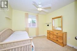 3rd BR on main level with window & ceiling fan -