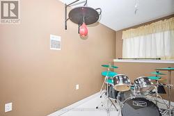 4th Bedroom on lower level with large window -